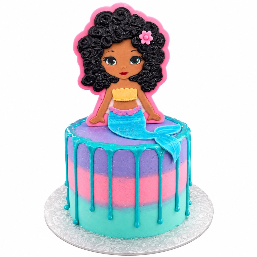Pastel mermaid drip cake with shells and tail