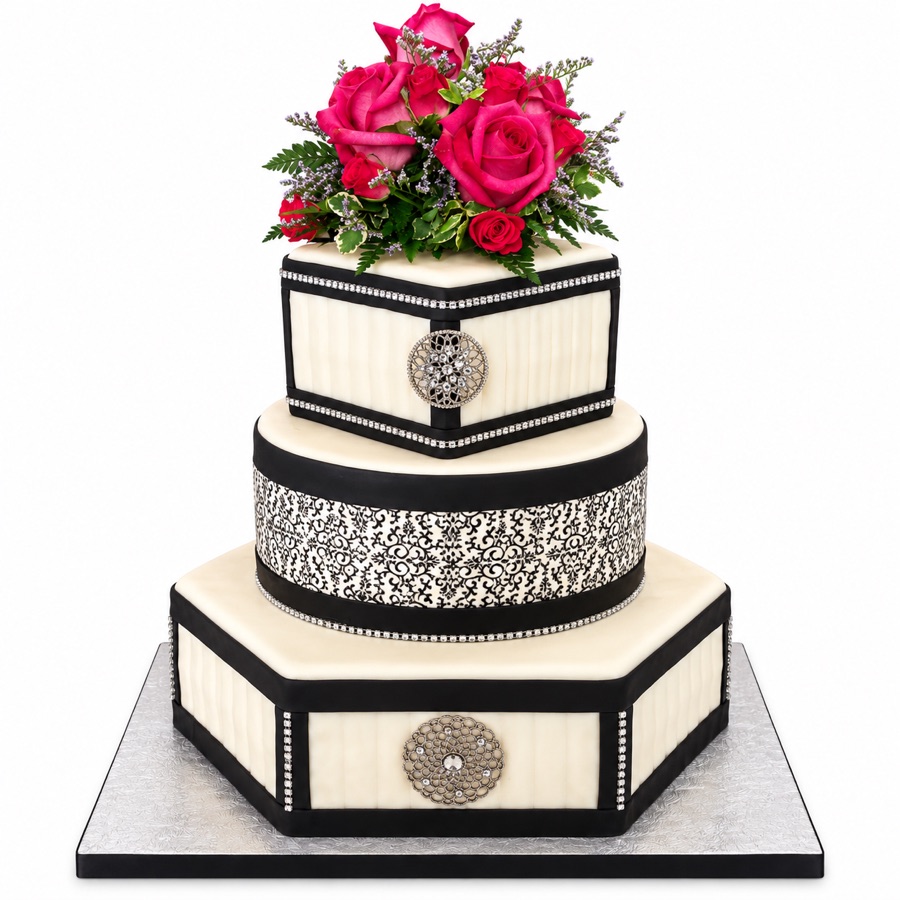 Geometric black and ivory wedding cake with pink roses